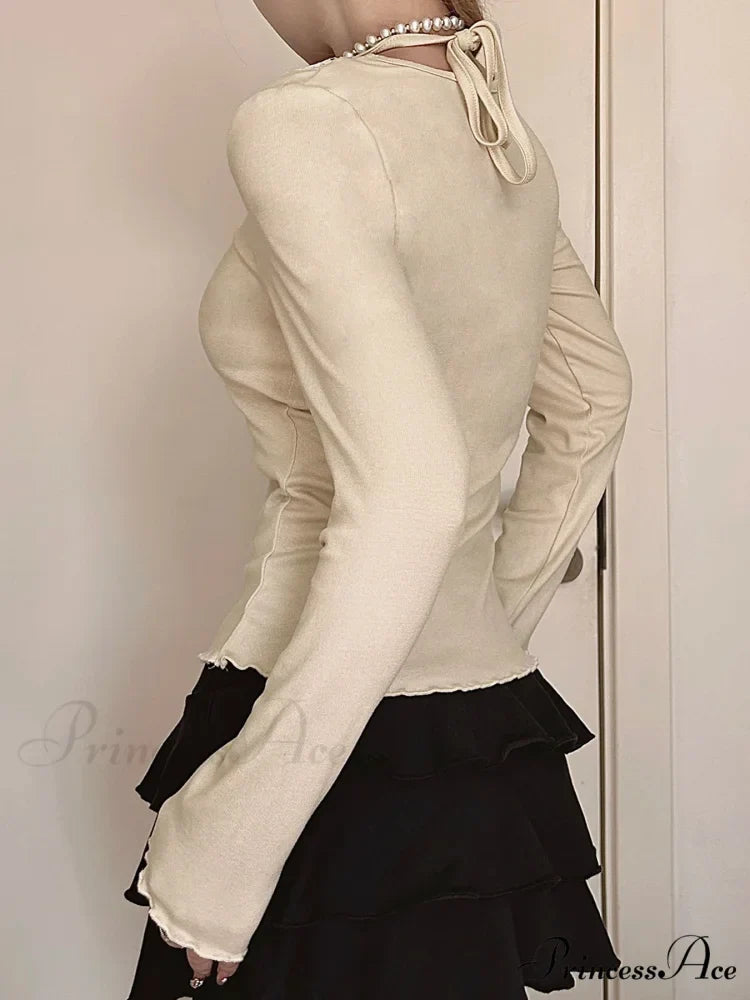 Bow Patchwork Lace Trim Halter V-Neck Long Sleeve Knit TopModified Title: Ribbon Patchwork Lace Trim Halter V-Neck Long Sleeve Knit Top