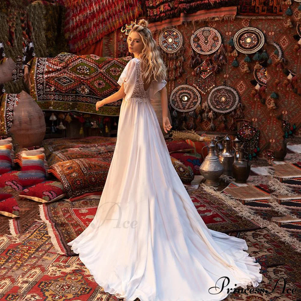 Brief Sleeve Profound Plunge Transparent Bridal Gown