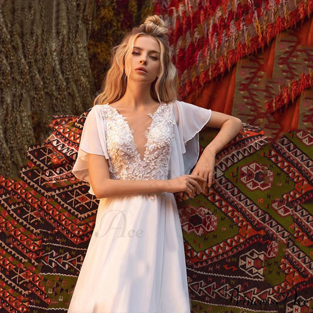 Brief Sleeve Profound Plunge Transparent Bridal Gown