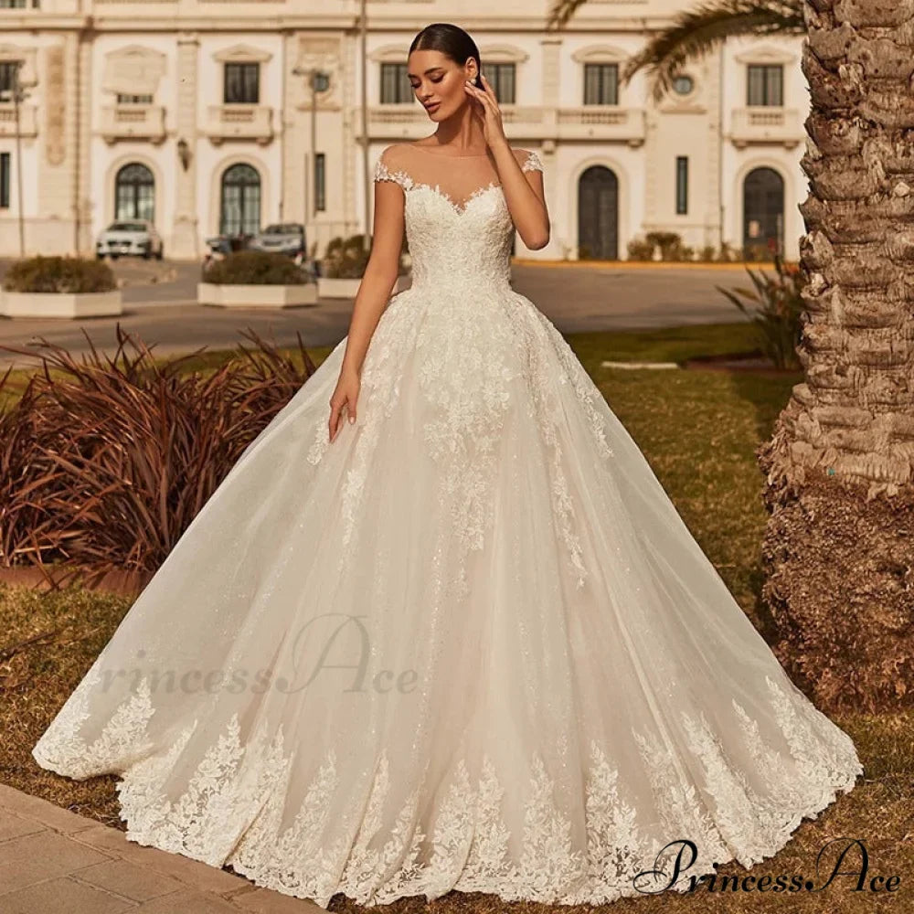 Creamy Ethereal Extended Train Wedding Gown
