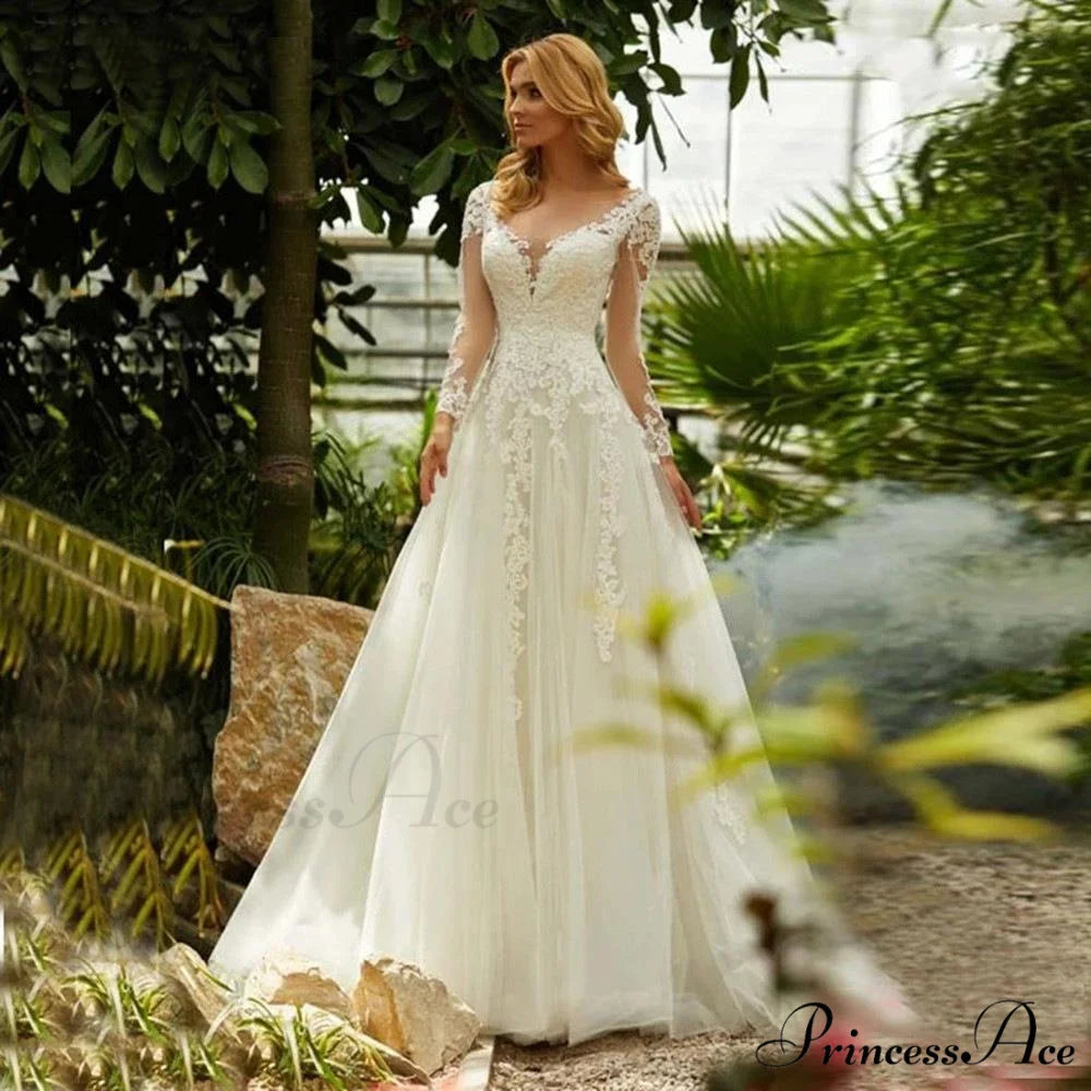 Deep Neck Extended Sleeve Transparent Wedding Gown