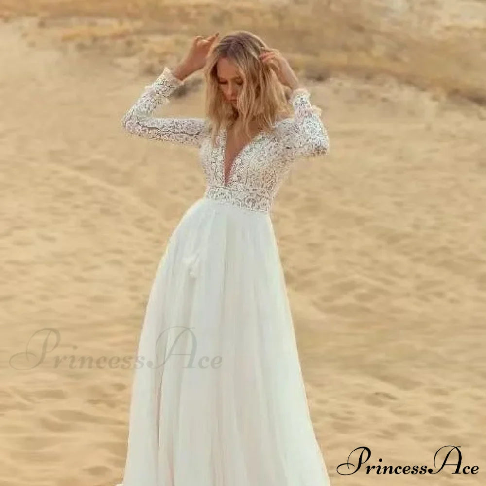 Deep Plunge Neckline Extended Sleeve Lace Bridal Gown
