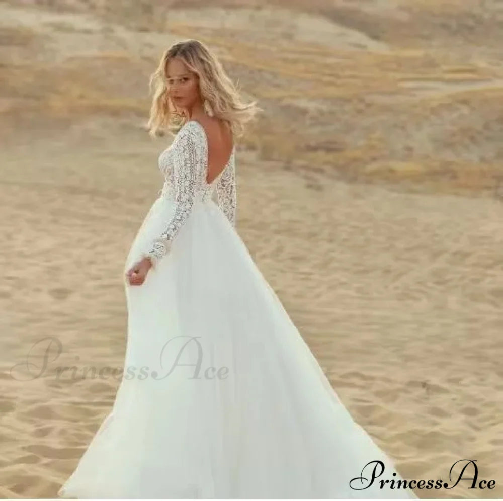 Deep Plunge Neckline Extended Sleeve Lace Bridal Gown