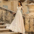 Extended Sleeve Open-Back Bridal Gown