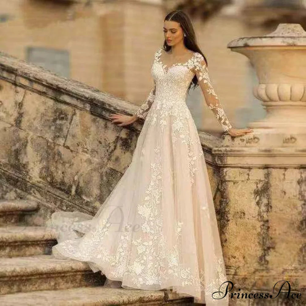 Extended Sleeve Open-Back Bridal Gown