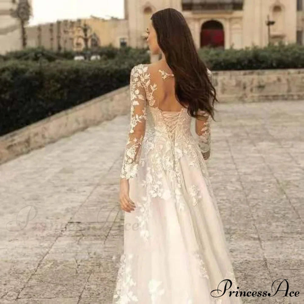 Extended Sleeve Open-Back Bridal Gown