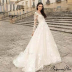 Extended Sleeve Open-Back Bridal Gown