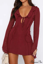Long Sleeved Ruffled Mini Dress with Lace Up Detail