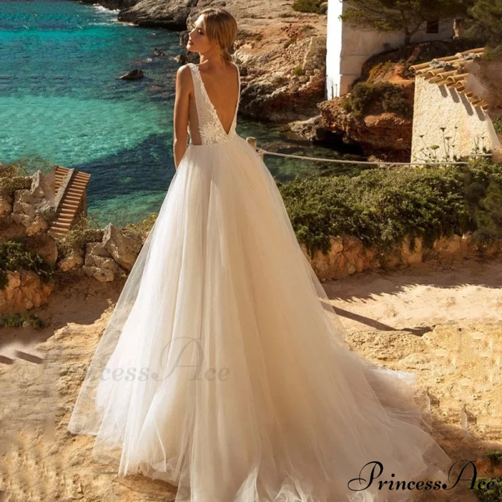 Low Plunging Backless Transparent Bridal Gown