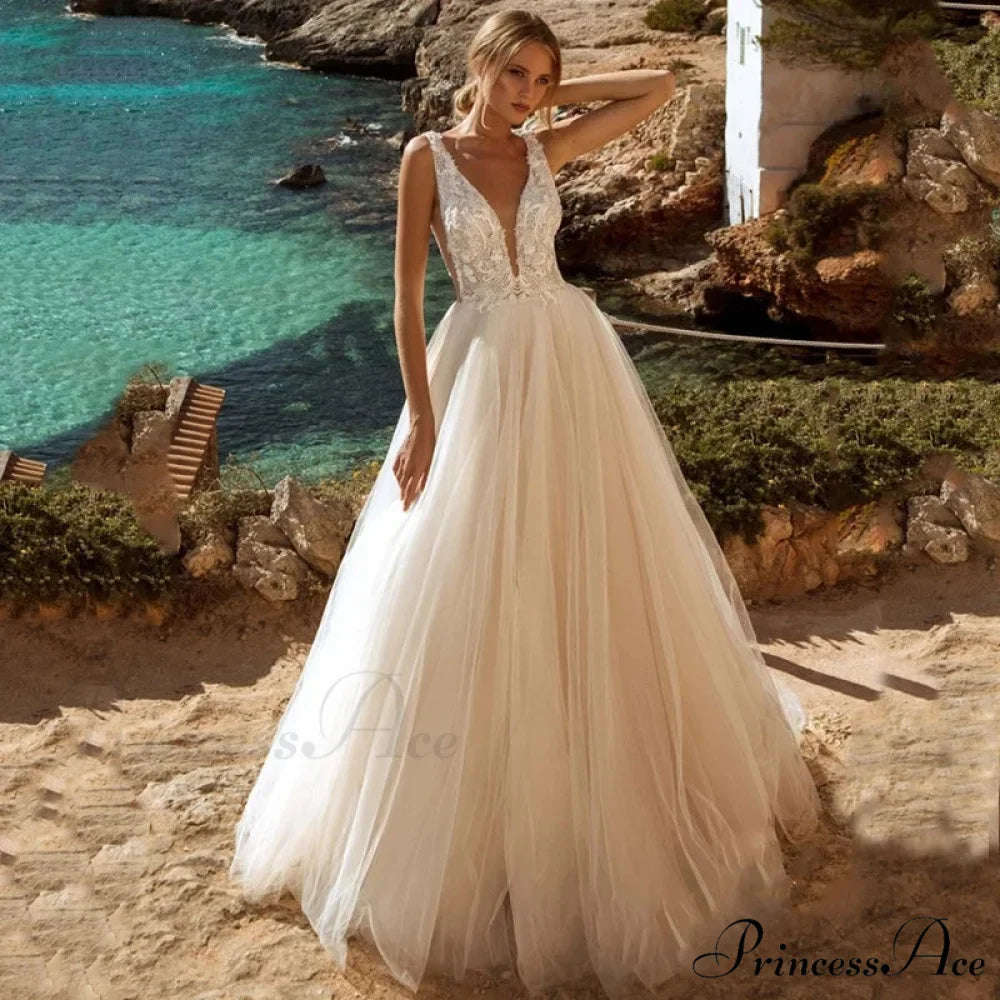 Low Plunging Backless Transparent Bridal Gown
