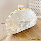 Shell Lace Embroidered Clutch WristletModified Title: Shell Lace Stitched Clutch Wristlet