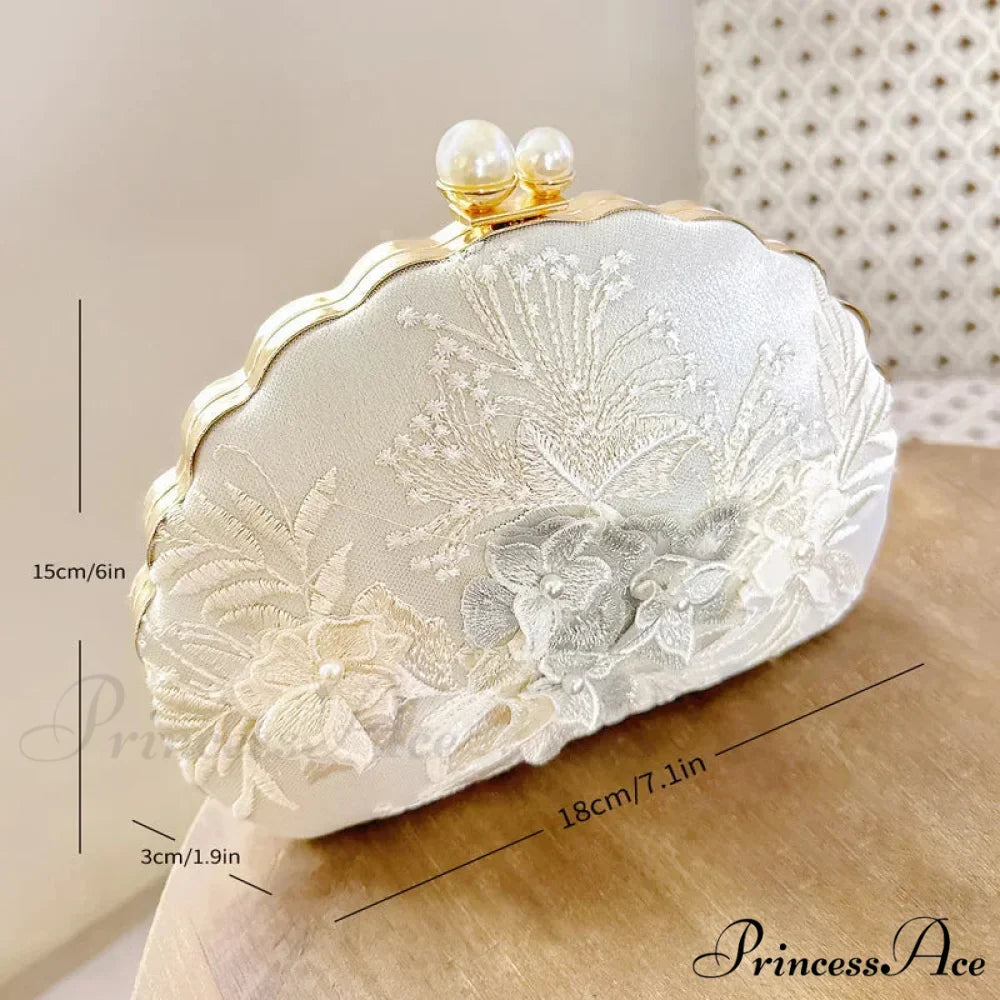 Shell Lace Embroidered Clutch WristletModified Title: Shell Lace Stitched Clutch Wristlet