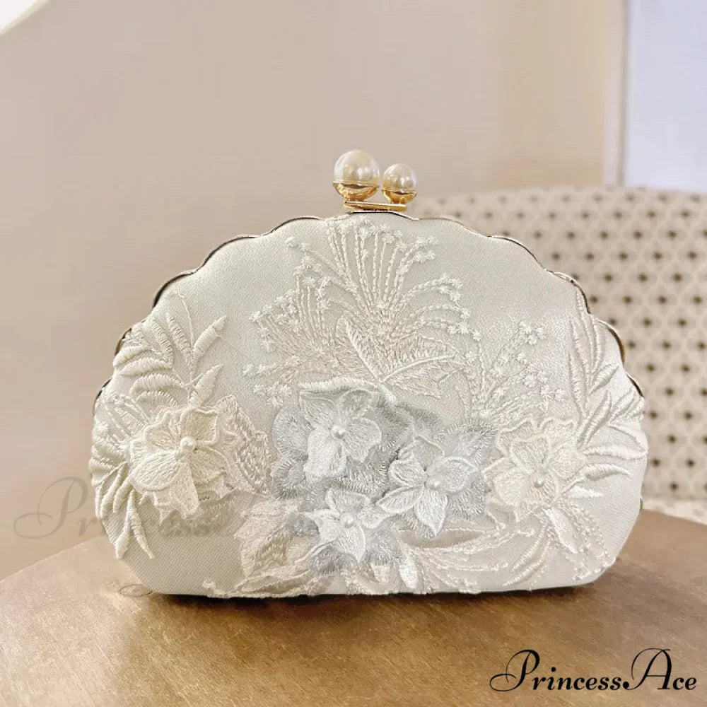 Shell Lace Embroidered Clutch WristletModified Title: Shell Lace Stitched Clutch Wristlet