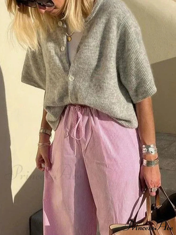 Sleeveless Circular Neck Button-Up Cardigan